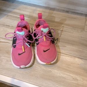 Nike pink and black sneakers with colorful strings